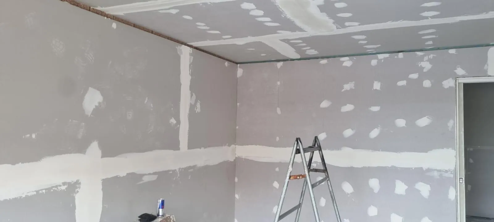 Drywall joints being plastered